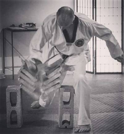 Master Doug Cook awarded 7th degree black belt Provided photo Master Doug Cook, owner and head instructor of the Chosun Taekwondo Academy in Warwick, was recently awarded his 7th degree black belt. He is pictured here breaking six bricks to demonstate mastery over raw power and supreme focus.