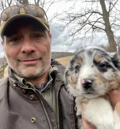 Brendan Mullally and his dog, Ozzie, in the fall of 2022.