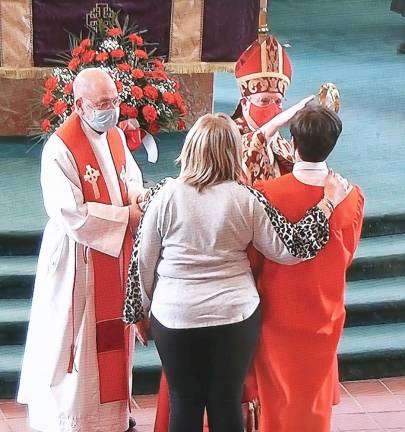 Each candidate, accompanied by his or her sponsor, came forward to be anointed and confirmed one by one by Bishop Gerardo J. Colacicco, Auxiliary Bishop of the Archdiocese of New York.