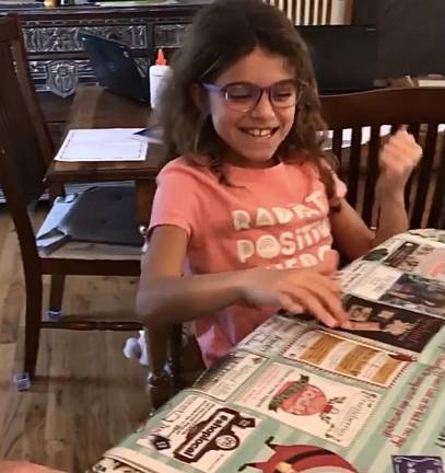 Warwick student Olivia R. fist-pumped and cheered “Yes!” upon discovering that she won The Warwick Advertiser’s wrapping paper contest.