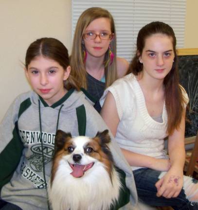 GWL Library hosts puppy training program Amber Rose (left), Hailee Maceda and Megan Horgan were among the young adults who attended the ìPuppy Loveî program held last month at Greenwood Lake Public Library. The program was led by Carolann Puzio, a certified therapy dog handler. Pictured with the three young woman is ìParmigiano Reggiano (Reggie) Corrado,î who is a registered service animal.