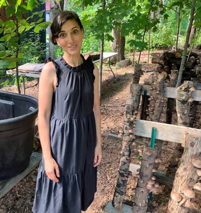 Local gardens win props for their crops at Kitchen Garden Tour Warwick gardener Aysha Venjara took first place for Best Garden this year. Here, she’s pictured with the mushrooms she grows on logs in her garden - a favorite among tour-goers. Photo by Minda Novek.