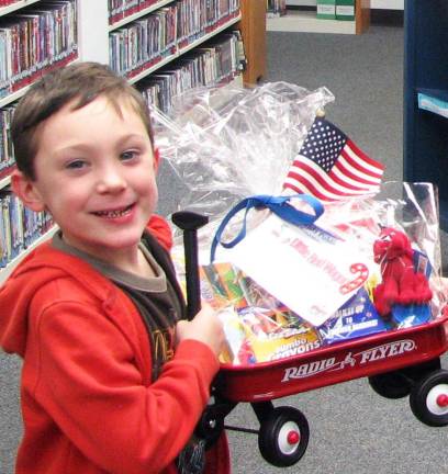 Little Red Wagon Reading Club James Walsh, a Kindergarten student at Golden Hill Elementary School in Florida, won the Florida Public Libraryís reading club raffle and a wagon full of books.