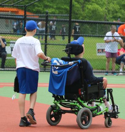 The Daniel Fratto Field for Beautiful People baseball program opens A player and his buddy.