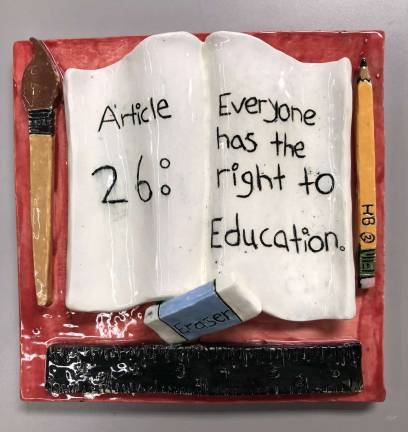 SUNY Orange hosts seventh annual 'An Artist’s Response to Human Rights' Washingtonville High School student Joydeanne Sanchez used clay and glaze to create "Education is Key."