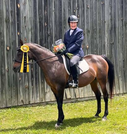 Jill Mante completes her ‘Ride of the Century’ Jill Mante of Warwick - pictured here with Electric Slide - was recently inducted into a nationally known group for senior dressage riders. Provided photo