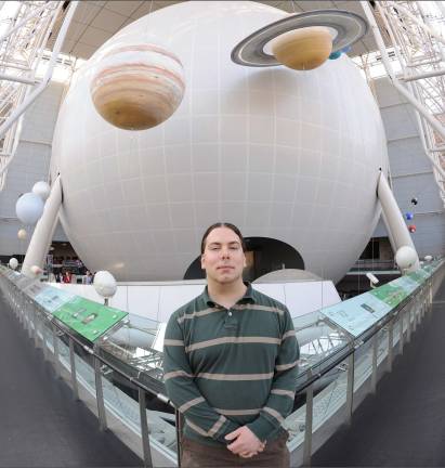 Astrophysics educator to explain the Solar System Photo by Roderick Mickens Astrophysics Educator Brian Levine in the Hayden Planetarium.
