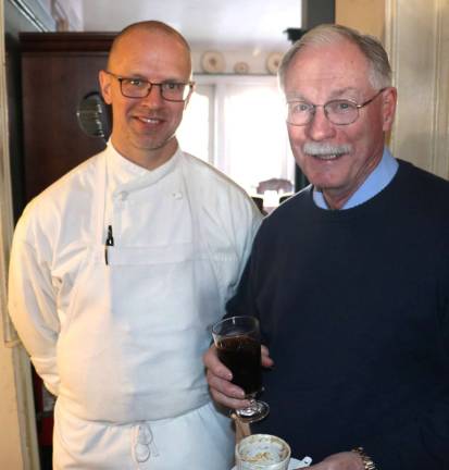 Warwick Historical Society's annual Tavern Night held at Iron Forge Inn Chef Erik Johansen,a graduate of the Culinary Institute of America., chats with Warwick Historical Society volunteer George Knight.