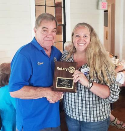 Stan Martin of Warwick has been named to the Rotary District 7210 Hall of Fame. Laura Barca, immediate past president of the Warwick Valley Rotary Club, presented the award during the July 12 club meeting at the Landmark Inn. Photos by Jim LaPlante.