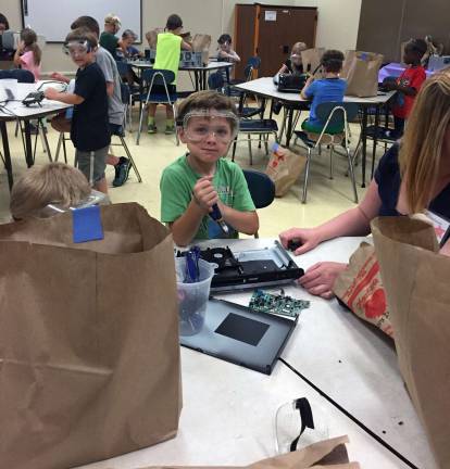 Summer learning at Warwick Valley's Camp Invention Among the projects undertaken by some of the campers was to take apart items such as computer hard drives to see how they worked so they could create their own inventions.