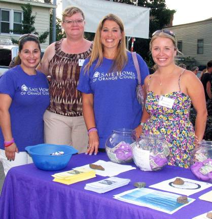 Ladies Night Out draws large crowds to downtown Warwick New for this year, the 2012 Ladies Night Out also benefited Safe Homes of Orange County, a nonprofit organization whose mission is to eliminate all forms of domestic violence through education, outreach and providing services to individuals and families affected by domestic abuse. Representing Safe Homes were, from left: Stephenie Molinelli, Shara Berb, Kelly Ann Kostyal-Larrier and Elston Craver.
