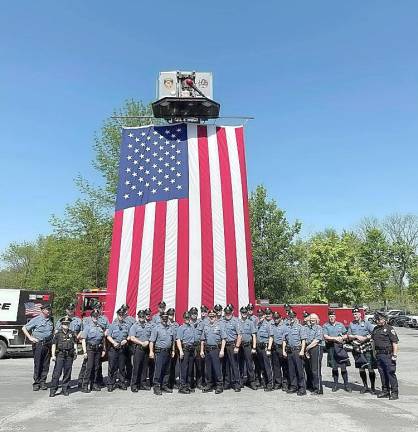 Warwick. Warwick Fire Department honors Police Officer Amie McGrady on her retirement Last Wednesday afternoon, May 19, the Warwick Fire Department and the Goodwill Hook and Ladder Company #1 provided a flag detail during walk out retirement services for Town of Warwick Police Officer Amie McGrady at Warwick Town Hall. The department was honored to be part of the service and would like to congratulate Officer McGrady on her retirement and to thank her for all of the years of service to the people of the Town of Warwick. Photo by Jennifer O’Connor courtesy of The Warwick Dispatch.