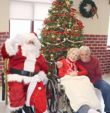 John Sabini and his wife, Mollie, a resident at Schervier Pavilion, enjoyed a visit with Santa.