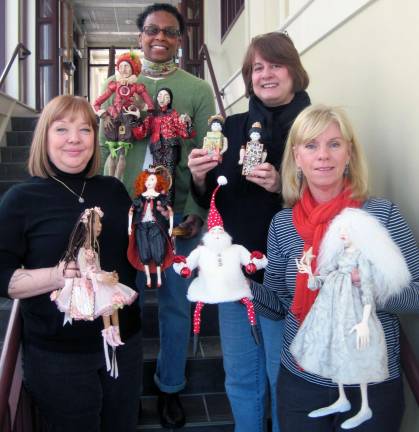 At the library Members of the The Warwick Doll Crafters Guild with their doll creations: Heather Brauner (bottom left); Lillian Alberti (top left); Elizabeth Parsons (top right); and Carol Andrews (bottom right).