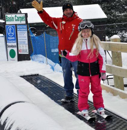 Mt. Peter unveils new lift Robert Gallo, Mountain School Director and Hailey Richardson take the first carpet ride on the new liift "Basin Carpet."