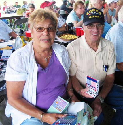Senior barbecue draws more than 700 people Photo by Roger Gavan Women won most of the prizes but the first man to win one was Bob Sanford pictured with his wife, Sandy.