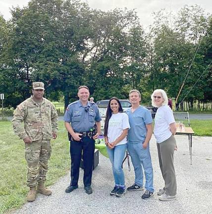 Spearheading Warwick’s National Night Out (from left) are: Sgt. Julio Fernandez from the National Guard, Warwick Police Officer David Serviss, Warwick Valley Prevention Coalition (WVPC) Coordinator Francesca Bryson, Healthcare Sector Representative Dr. Kevin Bryson and WVPC Program Director Annie Colonna. Provided photos.