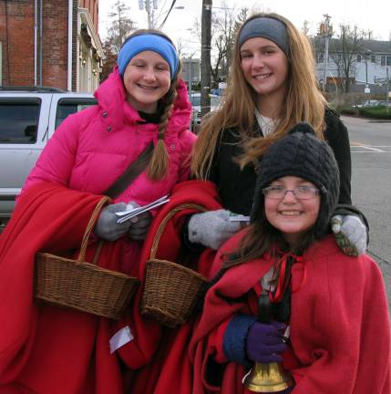 Shoppers braved the cold to be 'Home for the Holidays' Young volunteers for the Warwick Historical Society braved the cold weather to hand out a schedule of upcoming events. From left, Caeley Kardell, 14, Kailyn Ackerman, 9, and her sister Kendra, 14.