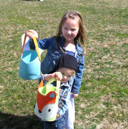 The great egg hunt at Pennings Farm always draws a crowd Kendall Chase, 5, and her brother Bode, 2, are ready to head back to their home in Vernon, NJ, with bags full of candy.