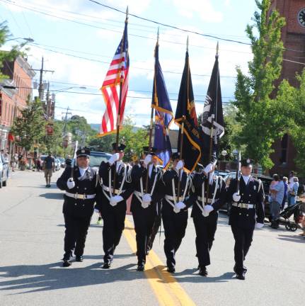 Village of Warwick celebrates 150 years A colorguard shows its colors at the start of the parade. (Photos by Roger Gavan)