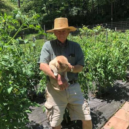 From a victory garden, to a victorious garden Frank Hennion and his garden cat, Buffy.