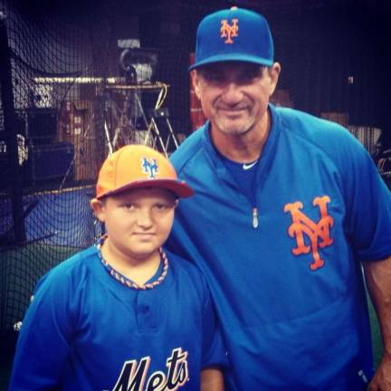 Florida youth takes batting practice with the Mets Daniel Weslowski, 10, at Citi Field with Mets' hitting coach Dave Hudgens.