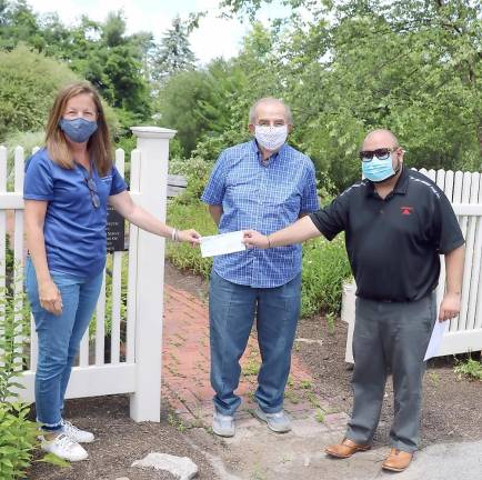 From left, Sue Ferro, executive director of Winslow Therapeutic Riding Center, Leo Kaytes Sr., Winslow Board of Directors chairman emeritus, and Ashish Anand, owner of State Farm Insurance on the Carriage Path. Photo by Roger Gavan.