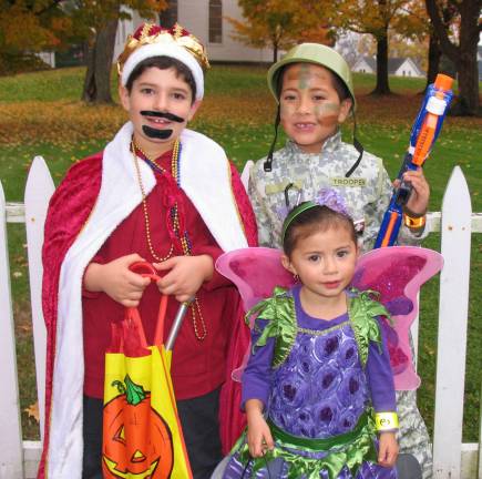 Halloween makes a comeback From left, "The king," Mason Vitiello, 8, his sister "Purple Daisy," Zoe and "Trooper" Sean Chocallo, 7.
