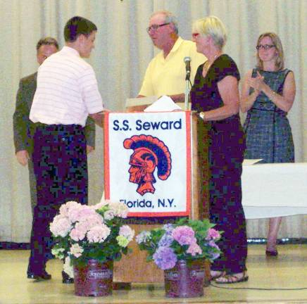 Michael Kamrowski awarded the first Black Dirt Feast scholarship Photo by Peter Hall Sally and Bob Scheuermann present the Black Dirt Feast Scholarship award to Michael Kamrowski, as Principal Michael Rheaume and Assistant Principal Susan Moore look on.