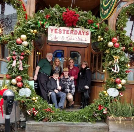 The story behind Yesterday's wreath Provided phioto On Sunday, December 3, William Kudla, 92, and members of his family came to Yesterday's for lunch. The wreath was a total surprise and they posed inside for another photo. Rear from left, Yesterday's owner John Christison, Kim Kudla, Darlene Kudla-Grasso and Patricia Kudla Front from left, William Kudla, 92, and his grandson Bryson Nieves.