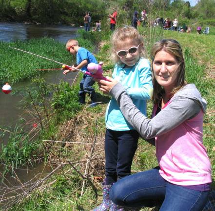The fish were jumpin' Mother and daughter - Michelle Boehlers has been giving her daughter Brooke, 5, a few fishing tips.
