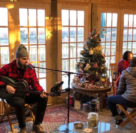 This Saturday and Sunday is Ugly Sweater Weekend at Apple Dave's Distillery Provided photo Chris Raabe provides live musical entertainment often at Apple Dave's Distillery.