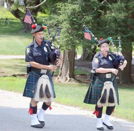 The parade was led by pipers from the Ancient Order of Hibernians who stopped to change from their traditional music to “Happy Birthday.”