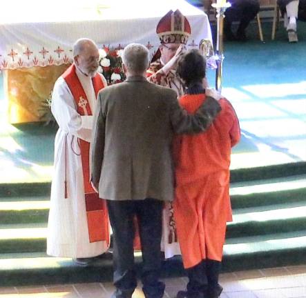 Then each candidate, accompanied by his or her sponsor, came forward to be anointed and confirmed one by one by the Bishop assisted by Rev. Jack Arlotta, pastor of St. Stephen’s.