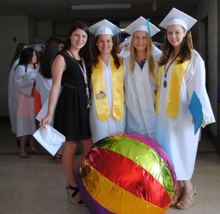 The Warwick Valley Class of 2013 Photo by Louise Hutchison Rory Dineen, Zoe Reece-Smith, Sini Laurila (exchange student from Finland) and Nora Petrucci with the giant graduation beach ball.