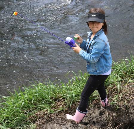 Come fish, go fish Lucy Ro, 6, looks like she knows what she's doing.