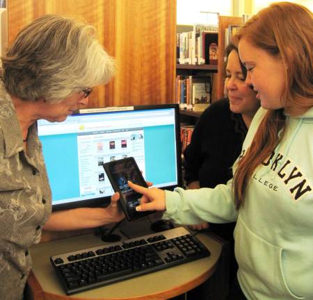 Library foundation raises $41,046 Albert Wisner Public Library Director Rosemary Cooper shows two patrons how to use one of the library's e-readers. The Library's Foundation reports that this year's annual appeal has raised a record $41,046 that will be used to purchase additional e-readers to be loaned with pre-loaded books and magazines and to support other library programs and services.