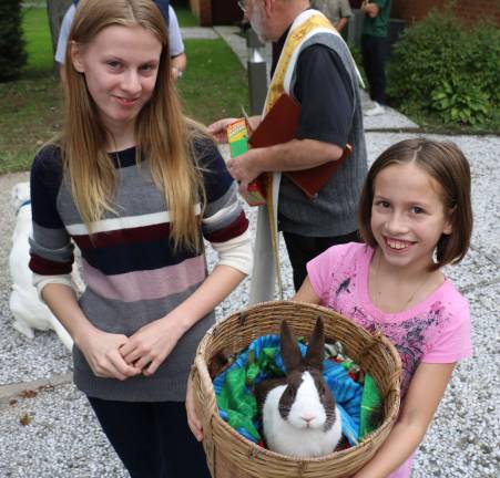 Parish holds Blessing of Animals in honor of St. Francis of Assisi Gabriella Brezina, 13, and her sister Anika, 9, brought their pet rabbit, "Hershey."
