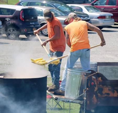 Members of the Town of Warwick DPW prepared corn-on-the-cob in the old fashion way in a big kettle over a wood fire.