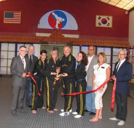 United Martial Arts Center has a new home Photo by Roger Gavan From left, Town of Warwick Supervisor Michael Sweeton, Warwick Valley Chamber of Commerce Executive Director Michael Johndrow, United Martial Arts Center Program Director Jason Bender, owners Teresa and Ed Ciarfella, their daughter Danielle, Chamber Board members Wayne Patterson and Mechelle Casciotta and Mayor Michael Newhard help celebrate the opening of the new United Martial Arts Center's home on West St.