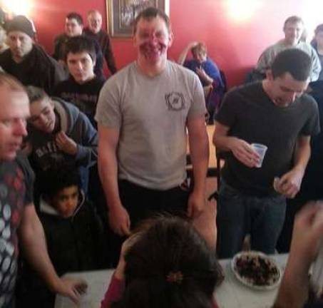 Celebrate National Pie Day at Noble Pies Michael Merner of Highland Lakes, N.J., smiles as he accepts the accolades for being 2012 pie-eating champion.