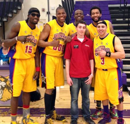 Project Graduation raises more than $7,000 with Harlem Wizards' basketball contest Provided photo Eddie Wood, a volunteer from ShopRite, poses with the Harlem Wizards. The Wizards played a team of Warwick Valley School District teachers, administrators and students and raised more than $7,000 during a fund raiser on March 23.