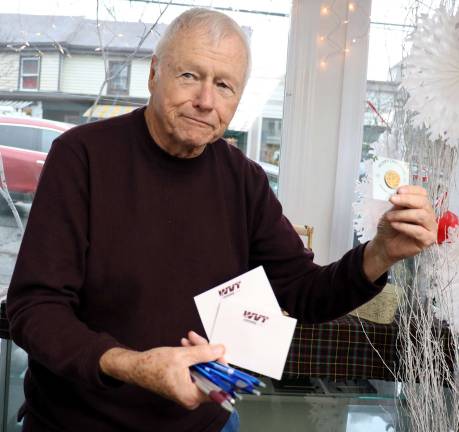 Warwick Sesquicentennial Committee holds Santa event at Akin's Pharmacy Committee member and retired Warwick Police Sergeant George Arnott donated 100 dollar coins engraved with the images of Sacagawea and Susan B. Anthony.