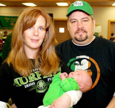 Prelude to a parade Photo by Ed Bailey Perhaps the youngest Irish lass at last Sunday's "Irish Day" was six-week old Kaytlyn Benard, held by mother Denise and father Patrick Benard of Greenwood Lake.