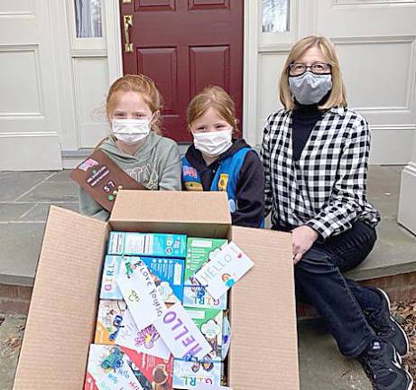 The Girl Scout Unit 229 of Florida donate cookies to Meals on Wheels of Warwick. Pictured from left to right are: Girl Scout Birdie Rogowski, Girl Scout Avery Rogowski and Judy Lindberg, Meals on Wheels volunteer.