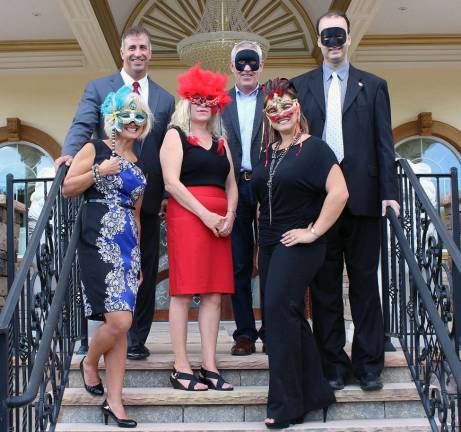 Warwick Valley Chamber of Commerce prepares for annual membership dinner Provided photo "A Night at the Masquerade" committee members line up in disguise at the entrance of Palacio Catering & Conference Center to finalize plans for the Warwick Valley Chamber of Commerce annual membership dinner on Nov. 1. Front from left: Co-chairs Janine Dethmers and Marci Oakley and Committee Member Kristen Weiss. Rear from left: Palacio General Manager Michael Guido, Warwick Valley Executive Director Michael Johndrow and Chamber President Paul Rafanello. Not available for the photo: Committee Member Kim Corkum.
