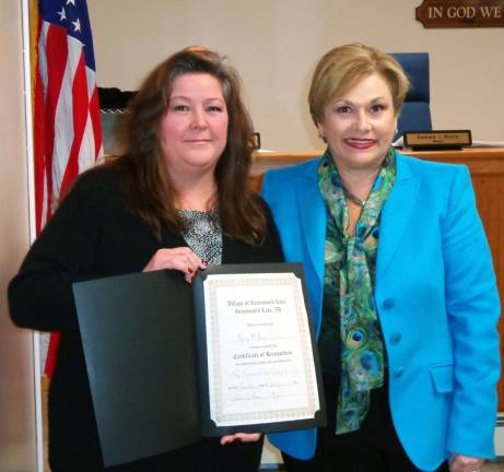 GWL Library’s music series recognized as the best On Jan. 7, Greenwood Lake Mayor Barbara Moore presented the Greenwood Lake Public Library with a certificate of recognition for its Ramapo Catskill Library Systemís 2012 Adult Program of the Year Award for the libraryís ìThursday Nite Music Makers Concert Series. Pictured here are Kelly Corrado, coordinator of adult services at the Greenwood Lake Public Library (left) and Mayor Barbara Moore. The recognition ceremony was also attended by Library Director Joan Carvajal (not pictured).