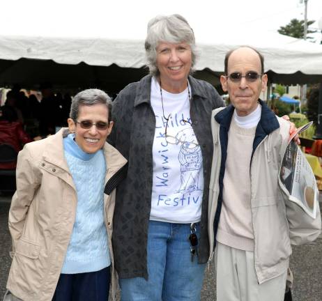 Children's 2018 Book Festival another huge success Albert Wisner Public Library Director Rosemary Cooper (center) poses with primary sponsors Glenn and Susan Dickes.