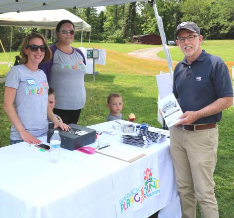 Play for the Park Summerfest raises more than $15,000 From left, Warwick Playground Dreams committee member Dana Tuckfelt, a mother of three girls, and Board Member Lisa Hroncich, a homeschooling mother with her two boys, welcome Town of Warwick Supervisor Michael Sweeton to Play for the Park.