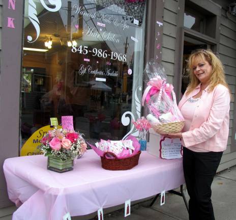Second annual Pink Friday fund raiser enjoys good turnout Photo by Roger Gavan Mary Lou Mortensen, a stylist at Warwick Hair, Nails and Spa conducted a free raffle for a basket of gifts and other prizes.
